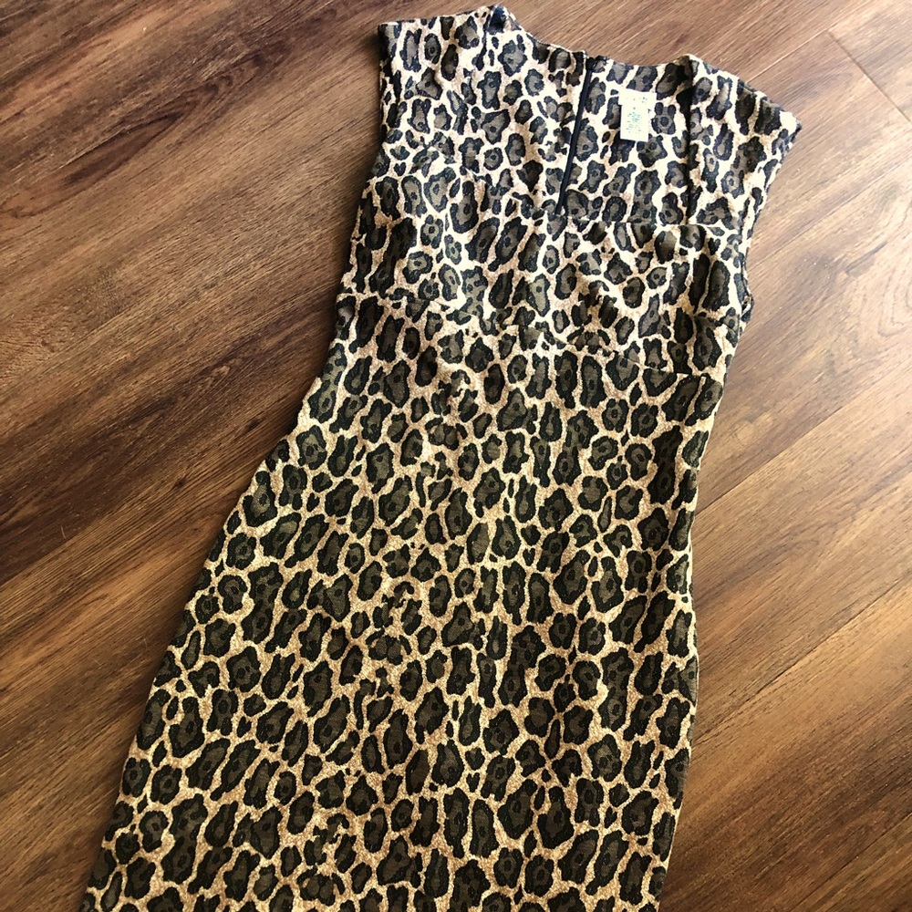 Cache brand leopard print dress. Semi cap sleeves. Hits below knee.